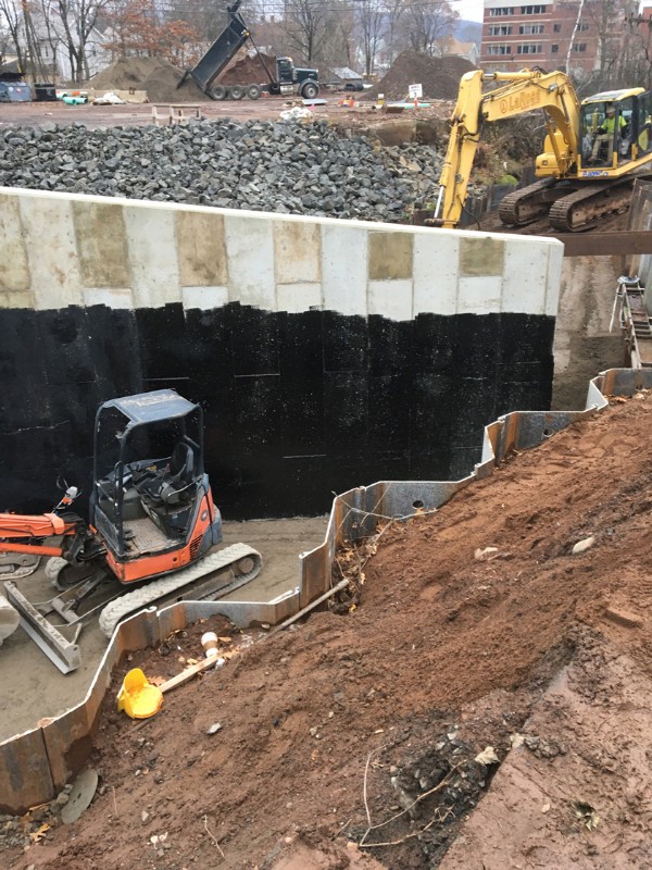 Concrete work in the excavated construction site.