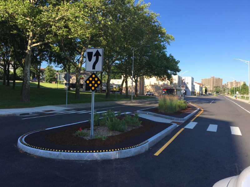 A newly installed traffic island with pedestrian crosswalk.