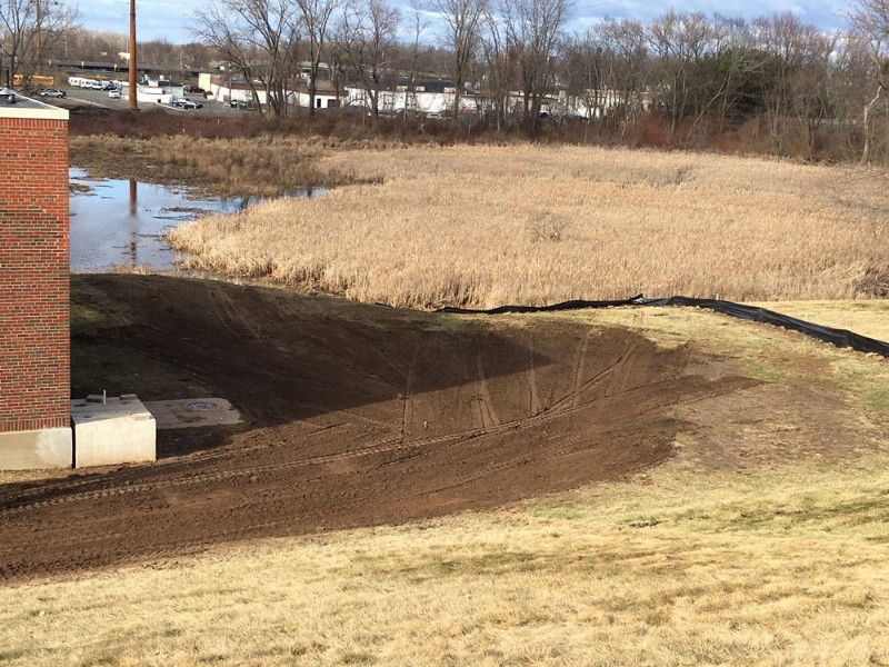Close-up view of land that has been backfilled and graded as part of the repair project.