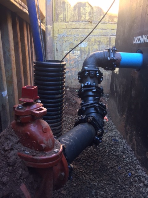 A new pump station installed in the trench.