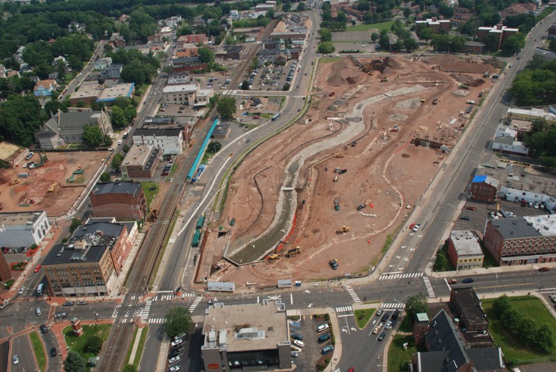 Aerial view of the construction site, with Harbor Brook running down the center.