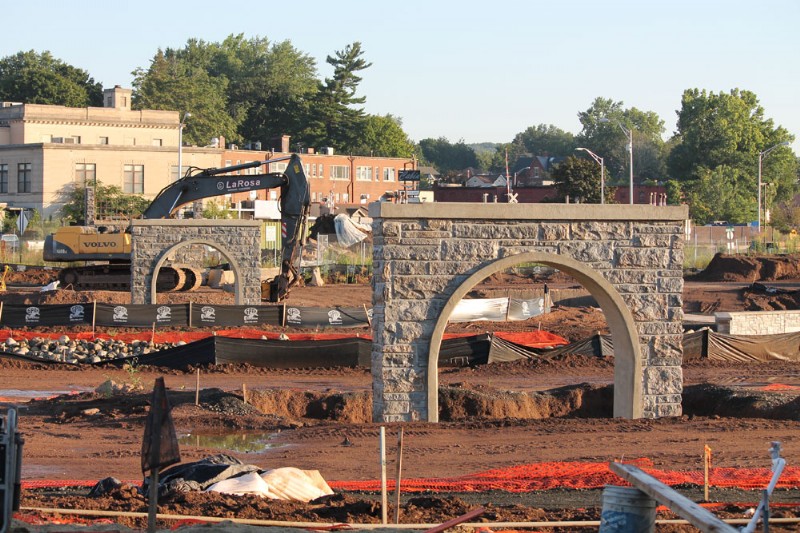 New concrete bridge supports installed over Harbor Brook during construction.