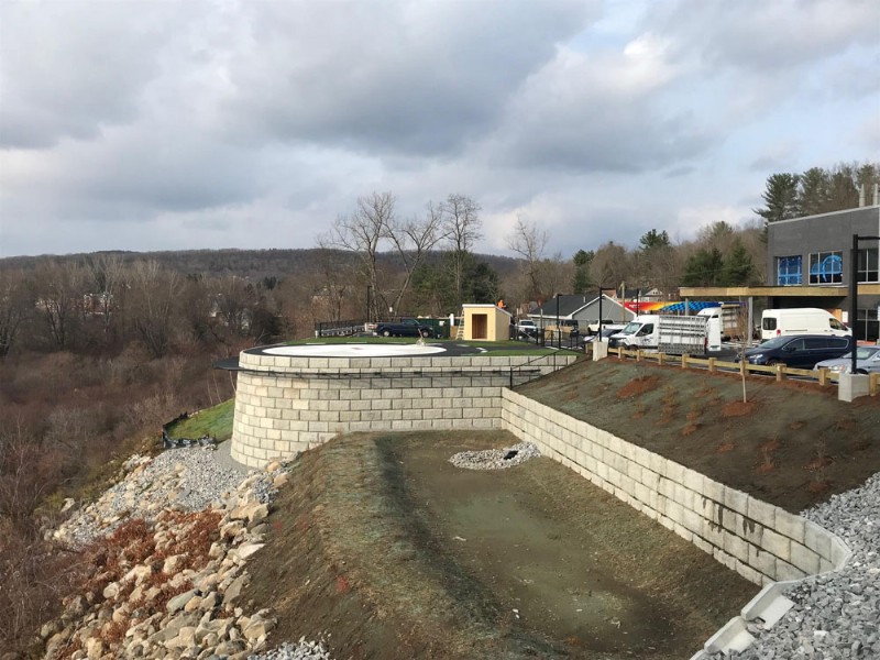 A view of the project area after completion, with cars seen in the parking lot near the helipad.