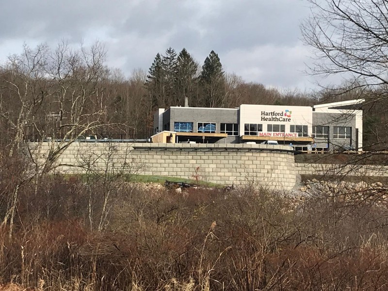 The Hartford HealthCare medical building seen with the new retaining wall in the foreground.